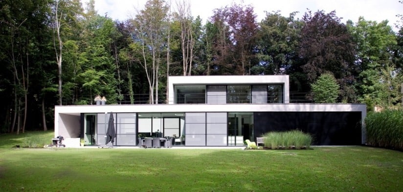 Panoramic windows help make this forest home a haven of peace and privacy